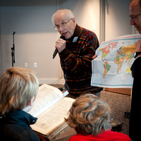 Don Balmer addresses the Children's Circle regarding his family bible